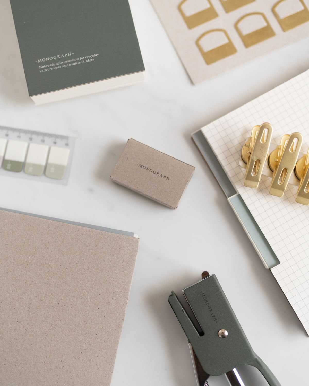 Neatly arranged stationery and workspace essentials on an office desk.