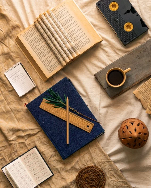 Reading nook flat lay with books and coffee