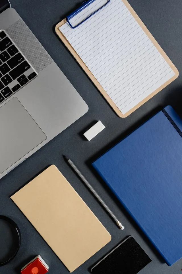 Modern workspace with laptop and clipboard